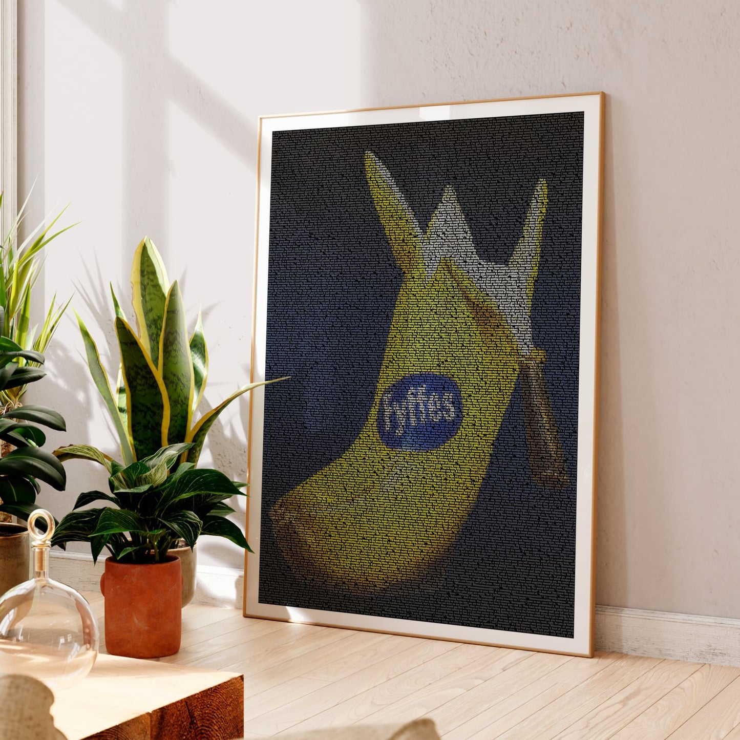 A framed art print featuring Billy Connolly's Big Banana Boot